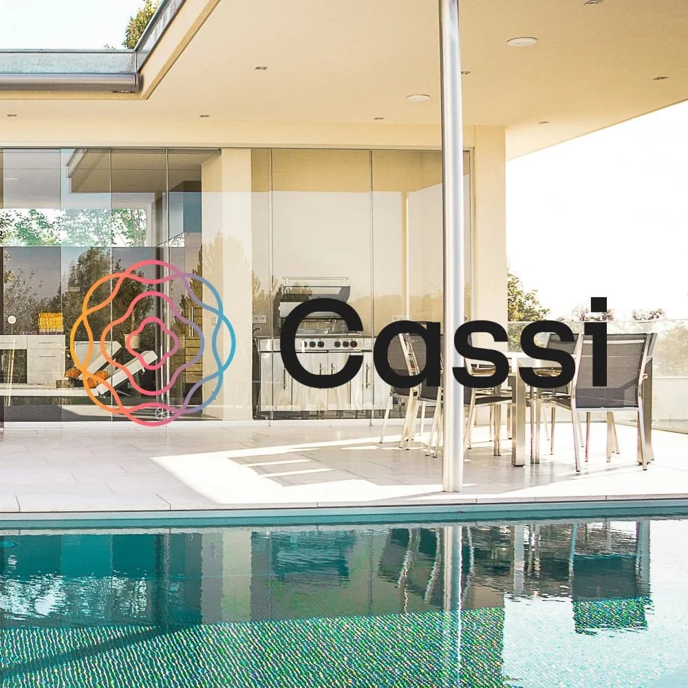 Cassi name and multicolored mark over a poolside home