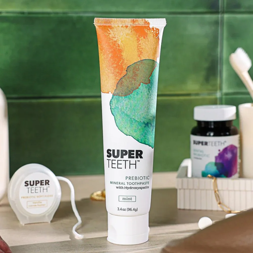 SuperTeeth toothpaste on a bathroom counter